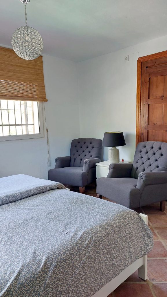 Bed and lounge chairs in Studio Cigarillo